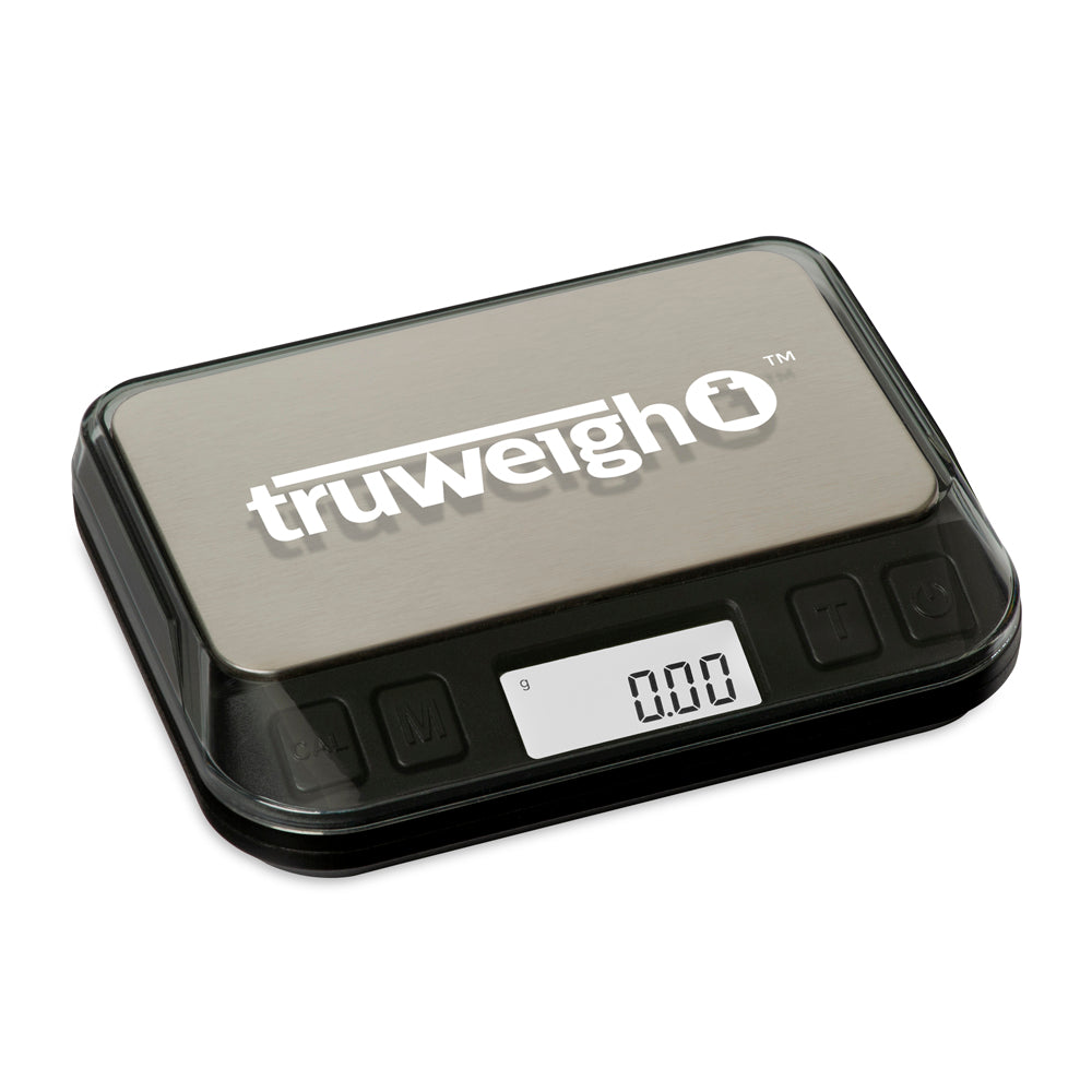 The Truweigh Zenith digital mini scale is turned on and shown on an angle