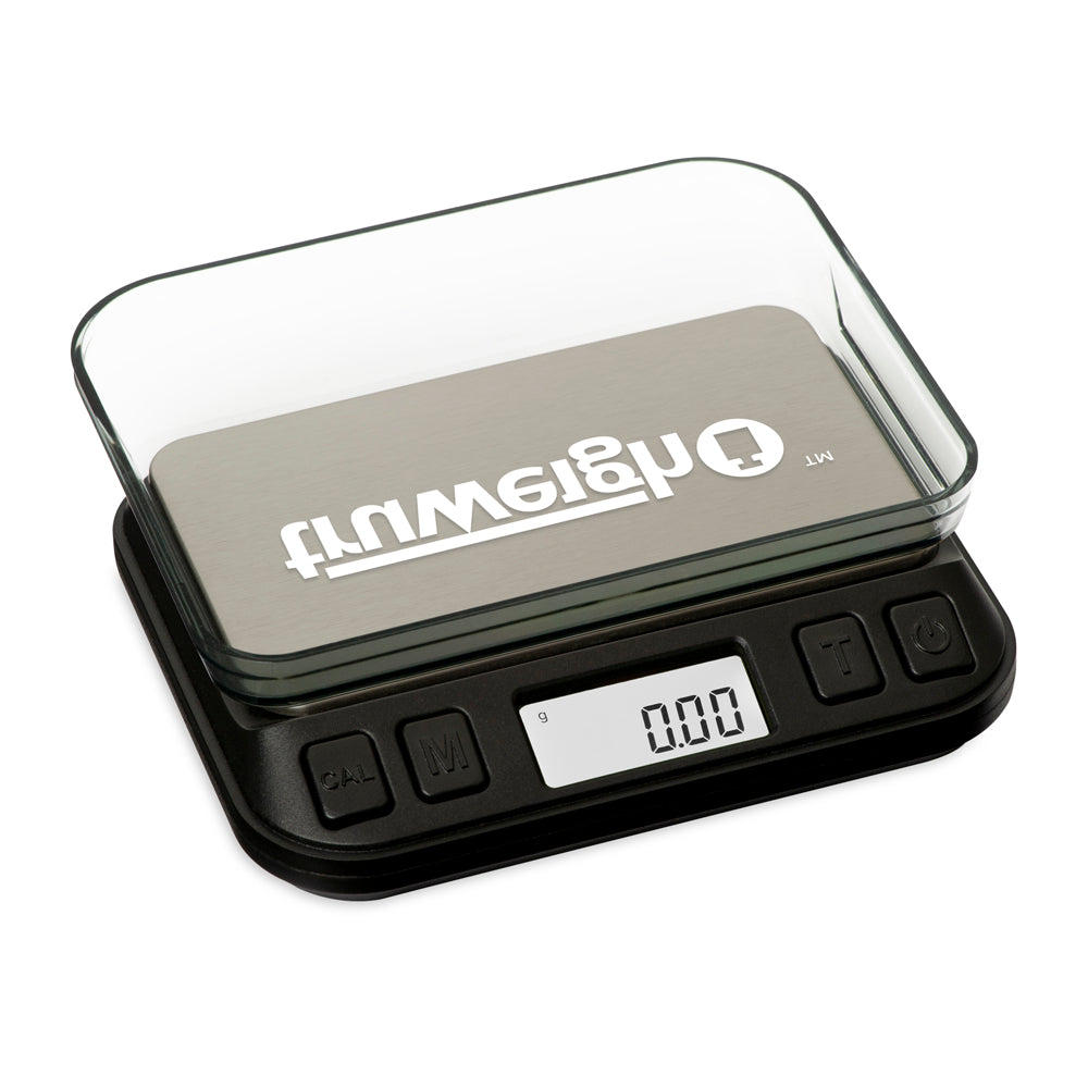 The Truweigh Zenith digital mini scale is turned on with the cover flipped over as a weighing tray