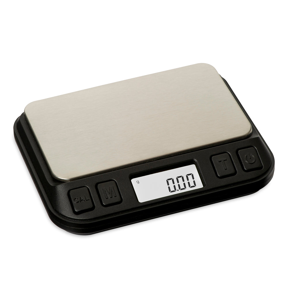 The Truweigh Zenith digital mini scale is turned on without the cover on, shown on an angle